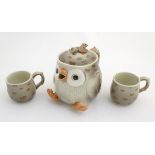 A Fitz and Floyd teapot formed as a grey owl with brown spotted feathers,