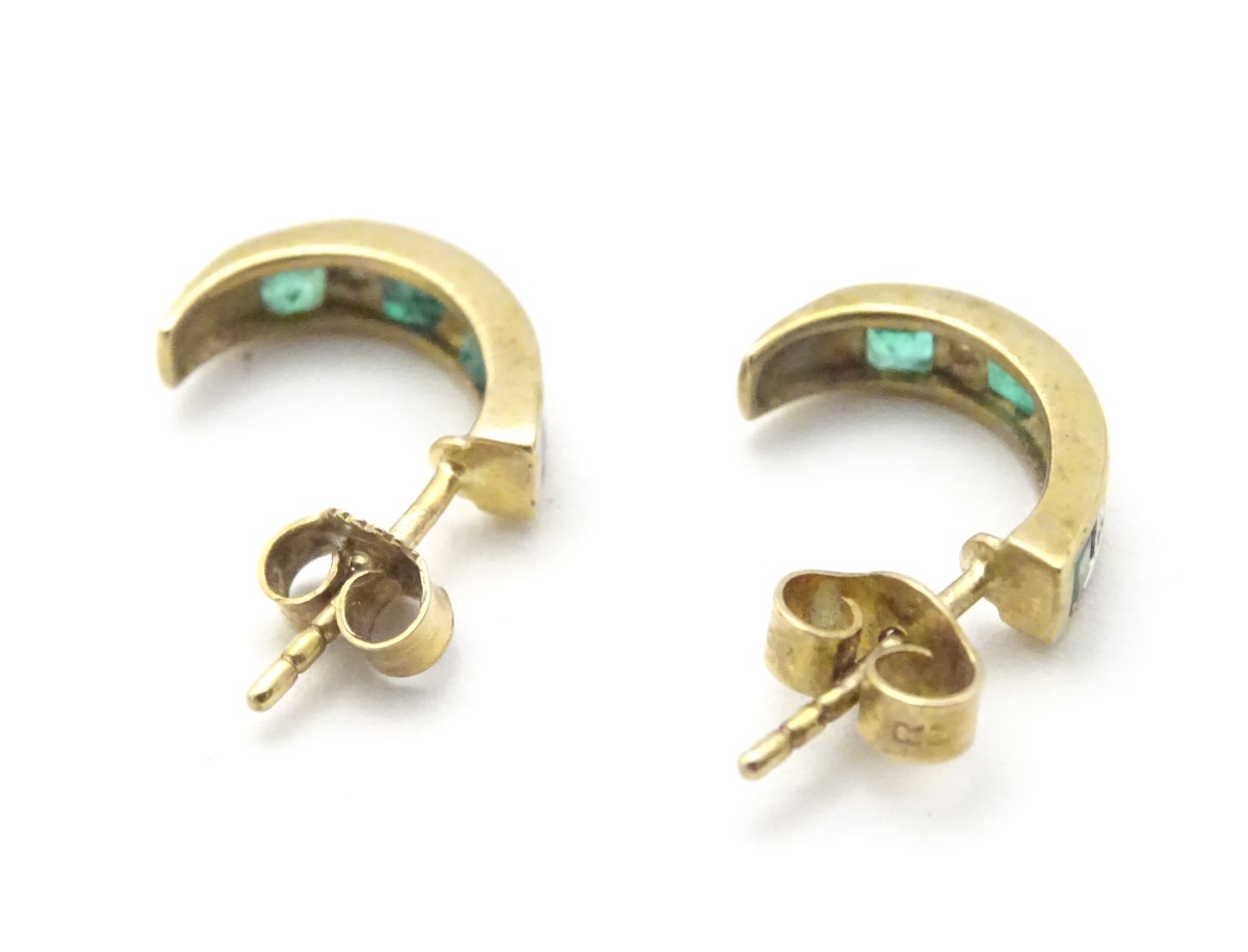 A pair of 9ct gold earrings set with diamonds and emeralds. - Image 8 of 11