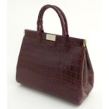 An Aspinal of London Dockery Bag, embossed calf leather 13" long, 7" deep, 10 1/2" tall.