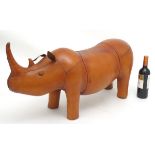 A large leather footstool formed as a rhinoceros.
