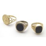 3 assorted Gentleman's signet rings comprising two 9ct gold examples and a silver example (3)