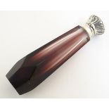 A 21stC amethyst glass scent/perfume bottle, fitted with a hinged white metal lid and collar.