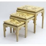 An early 20thC nest of three tables Oriental tables with decoration to the tops and brackets to the