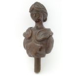 A folk art carved oak bust figure of a female in armour, 10" tall.