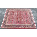 Carpet / Rug : A large Indian Amritsar carpet with 6 central vignettes, on a red background.