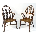 Two 18thC yew and ash Windsor chairs following the Strawberry Hill Gothic design,