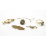 Assorted items comprising a 9ct gold brooch, silver gilt ring,