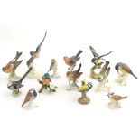 A large quantity of assorted porcelain models of birds,