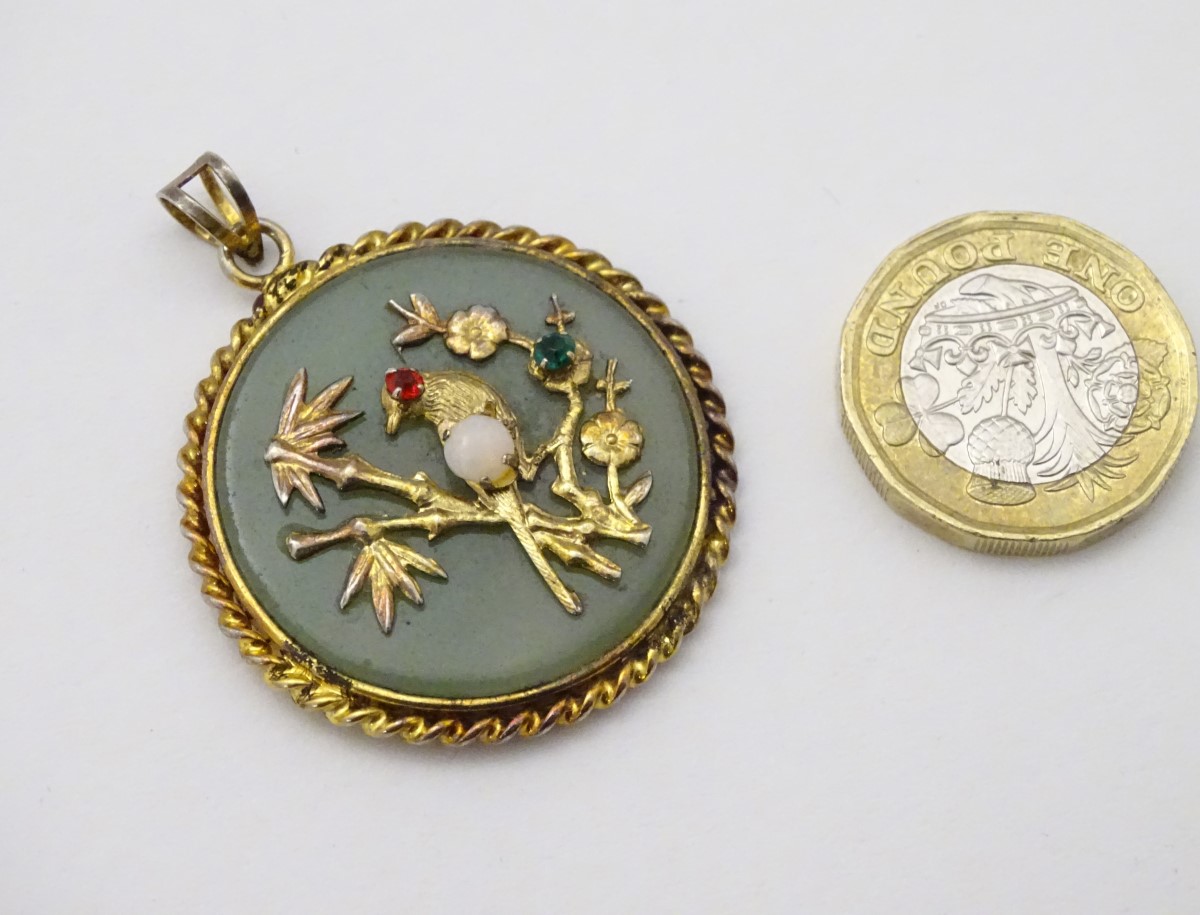 An Oriental pendant of circular form set with jadite stone to centre with bird and foliate - Image 5 of 10