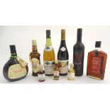 An assortment of bottles of wine and spirits, to include: Mersault 1982, Bouchard Pere & Fils,