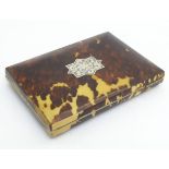 An unusual 19thC blond tortoise shell travelling card case with an engraved cabachon to top and