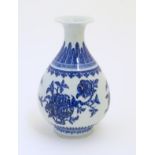 A Chinese blue and white pear shaped / yuhuchunping vase with a flared rim,