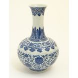 A Chinese blue and white 'Shang Ping' vase decorated with a broad band of flowers and scrolling