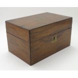 A 19thC walnut box with a brass escutcheon and a brass insert to lid. Approx.