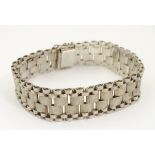 A silver bracelet of wide link strap form CONDITION: Please Note - we do not make