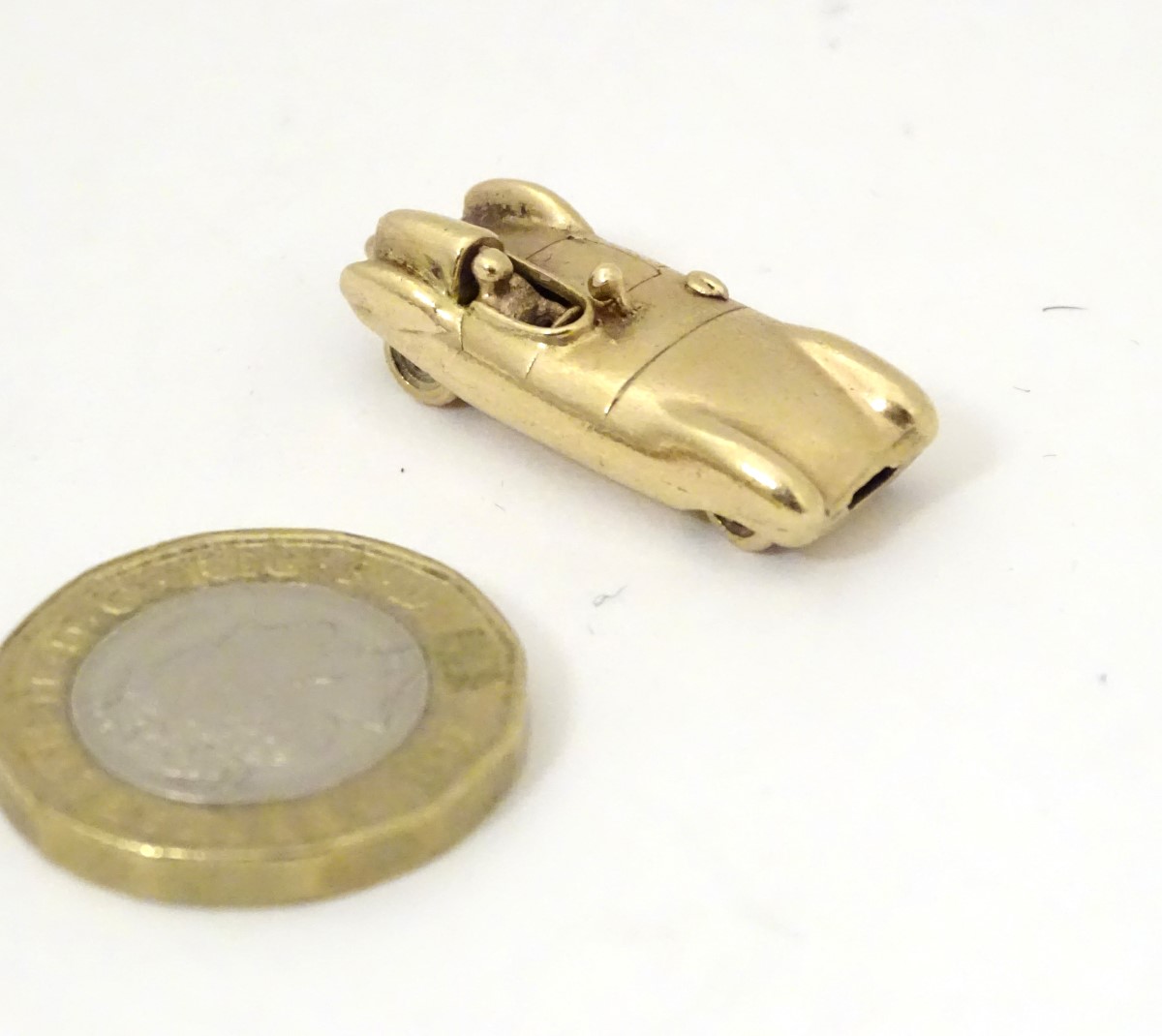 A gold vintage pendant / charm formed as an early racing car 1 1/8" long CONDITION: - Image 5 of 9