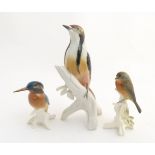 Three Karl Ens porcelain models of birds, comprising a greater spotted woodpecker,