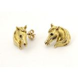 A 9ct gold stud earrings formed as horse heads set with blue spinel eyes.