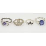 4 assorted silver / white metal rings CONDITION: Please Note - we do not make