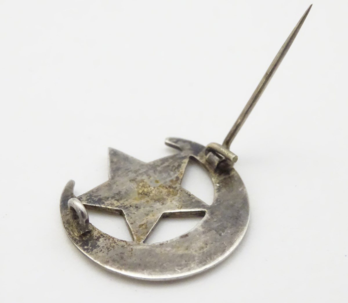 A white metal brooch formed as a crescent moon and star with damascene decoration titled ' Florrie - Image 7 of 7
