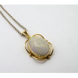 A gilt metal pendant set with opal cabochon with a 16” long 9ct gold chain CONDITION: