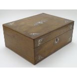 A wooden sewing box with mother of pearl / abalone decorative inlay with a fitted interior. Approx.