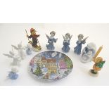 A quantity of assorted porcelain figures comprising angels playing musical instruments,