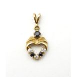 A 9ct gold pendant set with blue spinel and white stones.