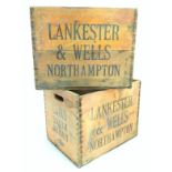 Advertising: two whiskey crates marked 'Laird Scotch Whisky' and 'Lankester & Wells, Northampton'.