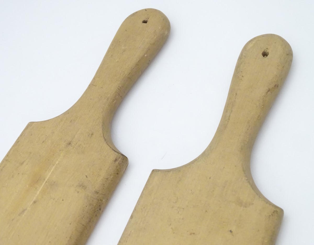 A pair of late 19th / early 20thC carved beech butter pats, each 11" long. - Image 8 of 8