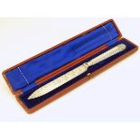 A cased silver plated bread / cake knife.