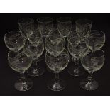 An assortment of wine glasses, each etched with barley decoration. 6+8, the largest 6" tall.