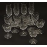 An assortment of crystal drinking glasses, comprising pedestal glasses (6),