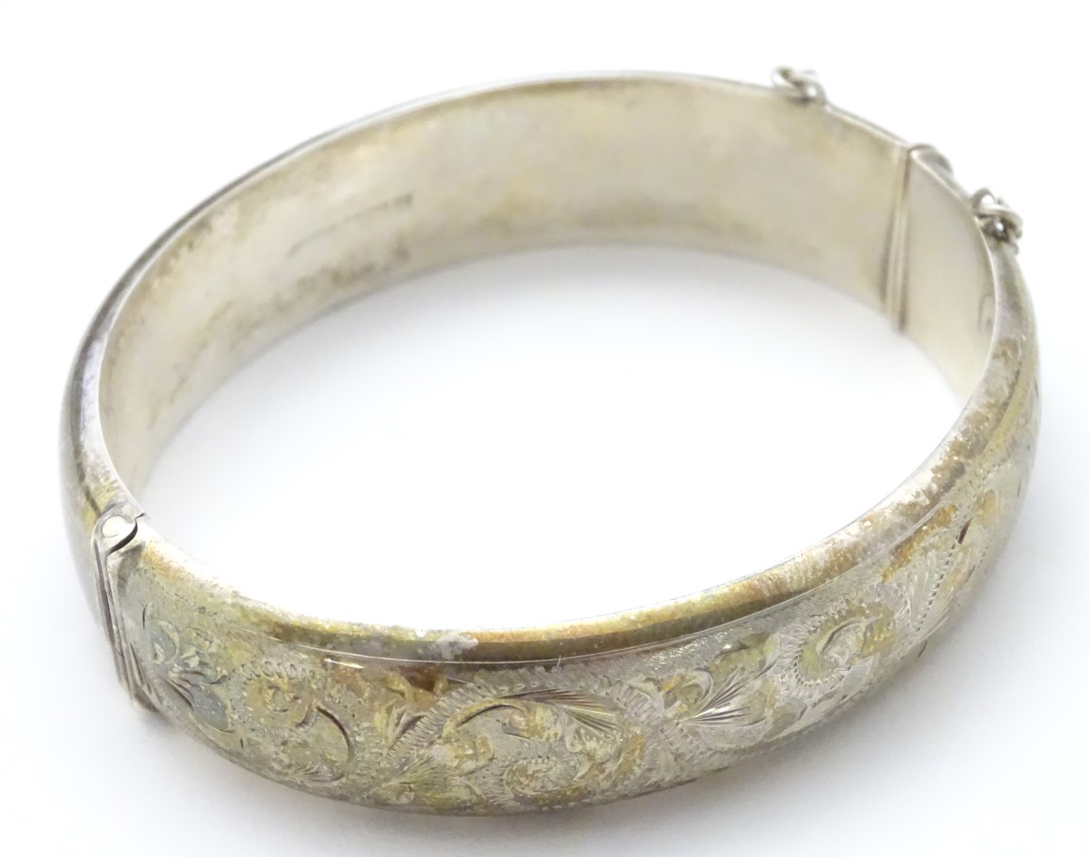 A hallmarked silver bangle formed ' Excalibur' bracelet with engraved decoration. - Image 4 of 5