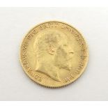 Coin: a 1910 half sovereign,