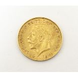 Coin: a 1911 half sovereign,