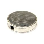 A French silver pill box of circular form with niello decoration.