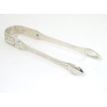 Geo III silver sugar tongs with bright cut decoration hallmarked London 1810 maker Samuel Godbehere,