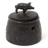 An Irish bog oak pot and cover with carved shamrock and harp decoration to the body of the pot,