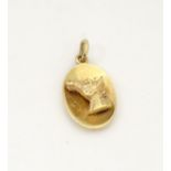 A 9ct gold pendant with horse head decoration. Hallmarked Birmingham 1966 maker Cohen & Charles .