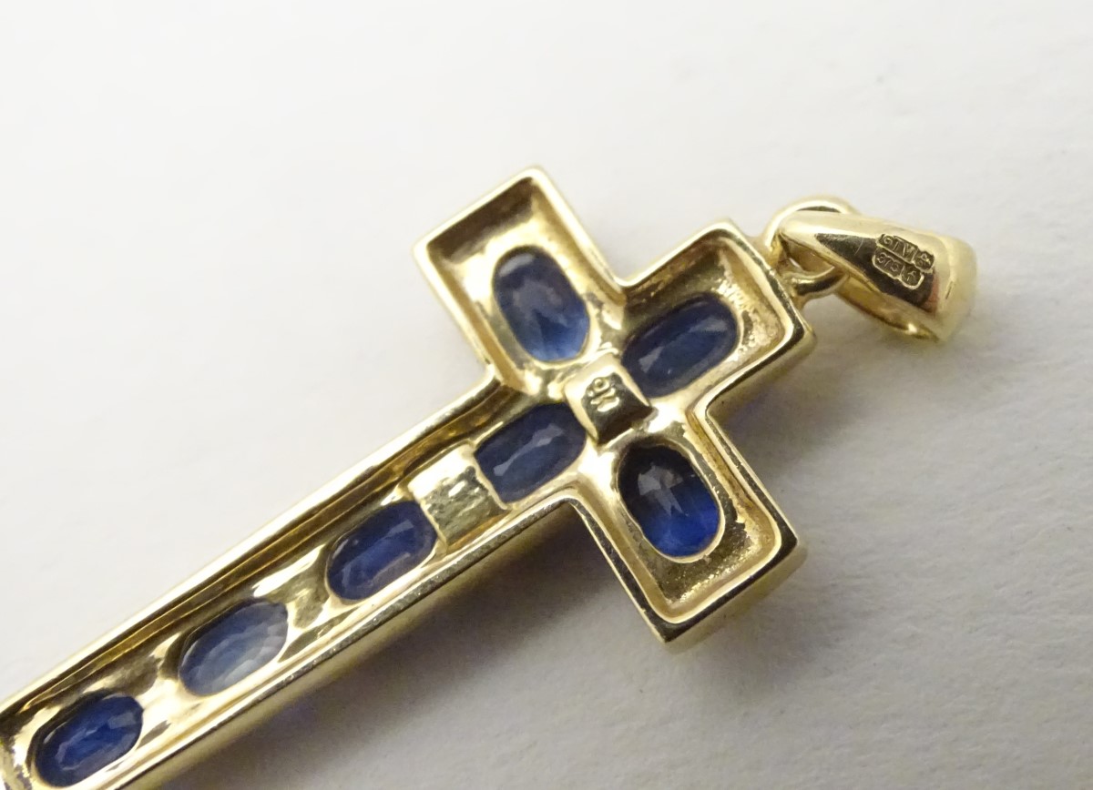 A 9ct gold cross formed pendant set with 7 topaz. - Image 3 of 4