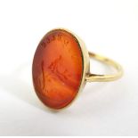 A 19thC French gold signet ring set with carnelian hardstone seal depicting a dove on a branch