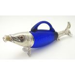 A novelty claret jug / decanter formed as a fish with blue glass body,