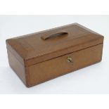 A 19thC Wells and Lambe box with embossed leather finish and a loop handle.