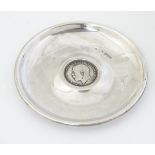 A silver pin dish set with Geo V one shilling coin to centre .