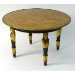 A 19thC Egyptian revival table with a burr walnut top having a gilt wood painted surround,