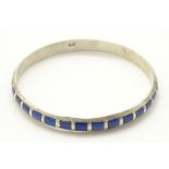 A silver bangle bracelet set with lapiz lazuli CONDITION: Please Note - we do not