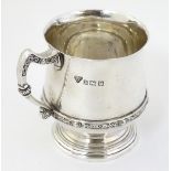 A silver tankard with banded Celtic decoration Hallmarked Birmingham 1957 maker Garrard & Co.