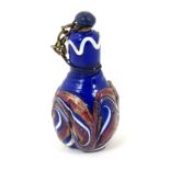 A miniature scent bottle with enamel decoration.