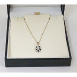 A 9ct gold necklace and pendant, the pendant set with a central opal,